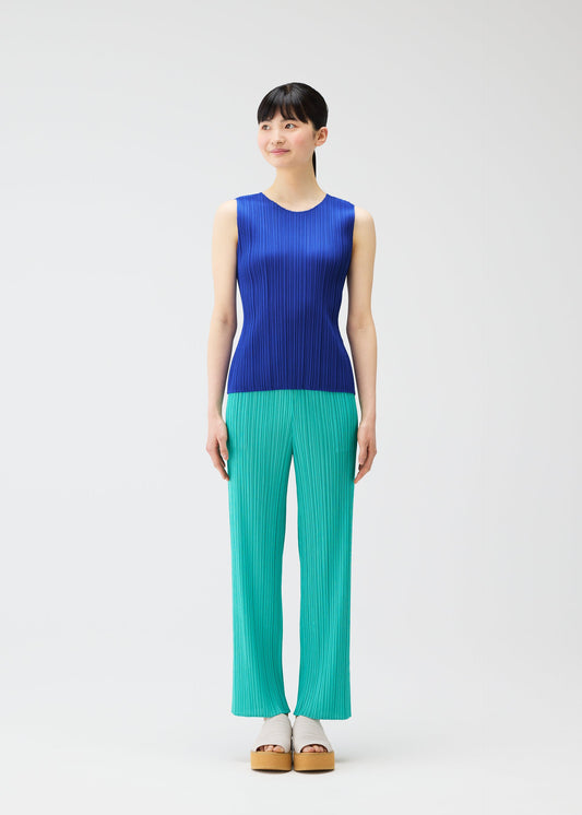 A model wears the PLEATS PLEASE ISSEY MIYAKE MONTHLY COLORS MAY top.