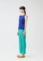 A model wears the PLEATS PLEASE ISSEY MIYAKE MONTHLY COLORS MAY top.