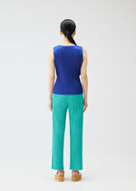 A model wears the PLEATS PLEASE ISSEY MIYAKE MONTHLY COLORS MAY top.