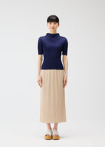 A model wears the PLEATS PLEASE ISSEY MIYAKE MONTHLY COLORS MAY top.