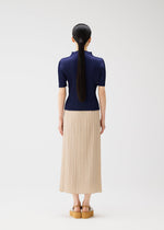 A model wears the PLEATS PLEASE ISSEY MIYAKE MONTHLY COLORS MAY top.