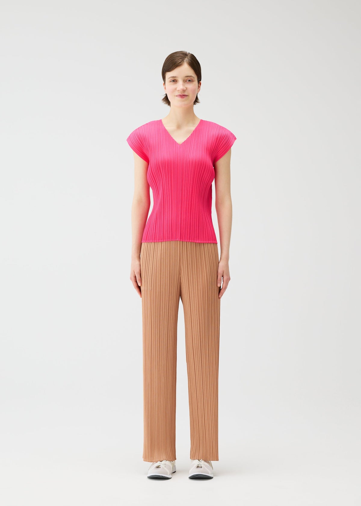 A model wears the PLEATS PLEASE ISSEY MIYAKE MONTHLY COLORS : JUNE monthly-colors-june-shirt-charcoal.