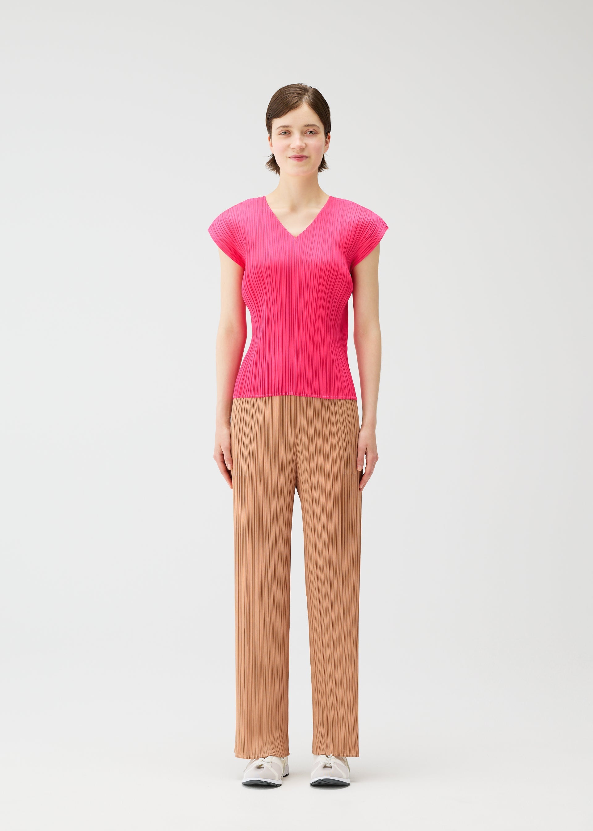 A model wears the PLEATS PLEASE ISSEY MIYAKE MONTHLY COLORS : JUNE monthly-colors-june-shirt-blue-green.