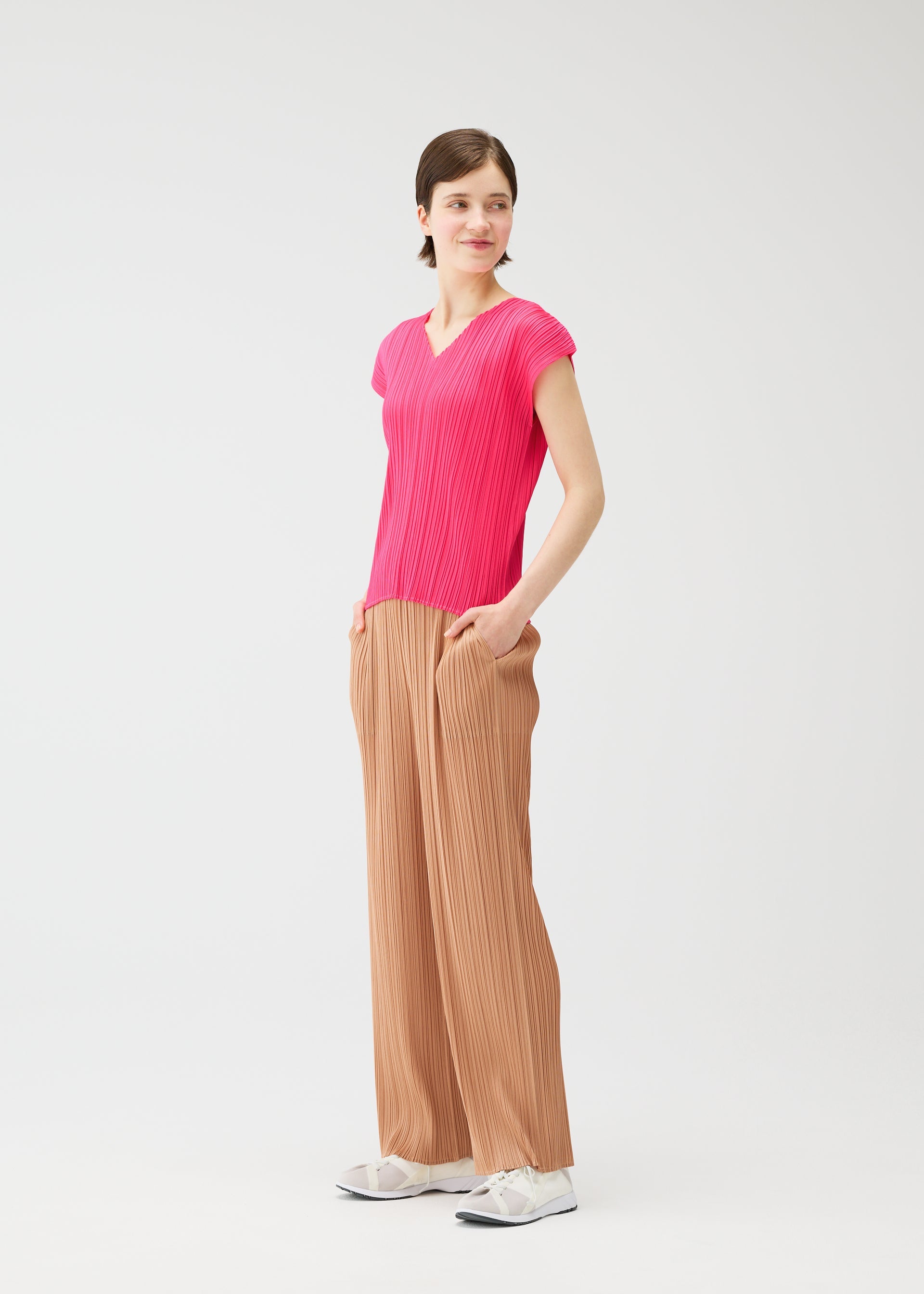 A model wears the PLEATS PLEASE ISSEY MIYAKE MONTHLY COLORS : JUNE monthly-colors-june-shirt-charcoal.