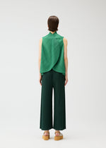 A model wears the PLEATS PLEASE ISSEY MIYAKE LEAF shirt.