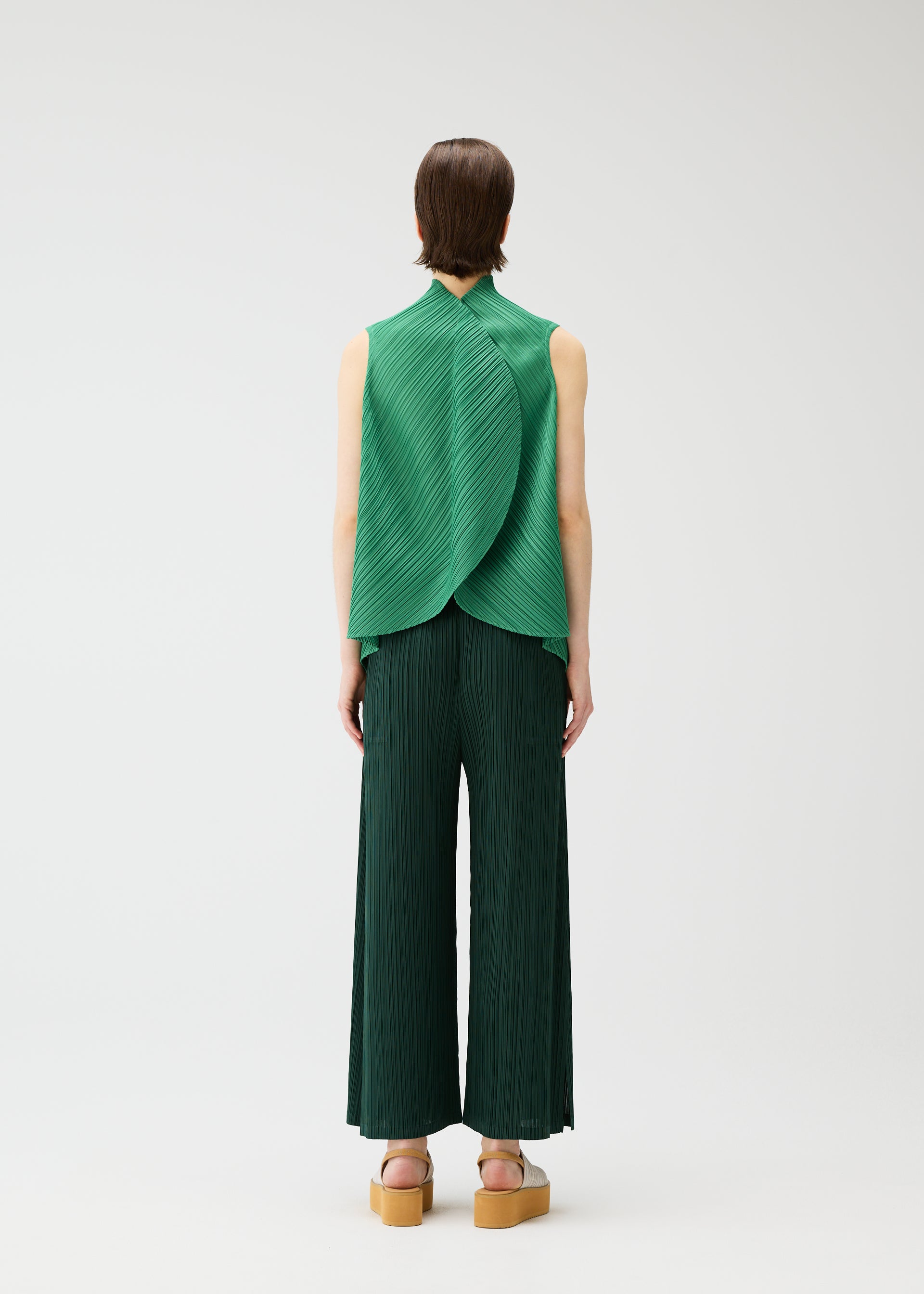 A model wears the PLEATS PLEASE ISSEY MIYAKE LEAF shirt.