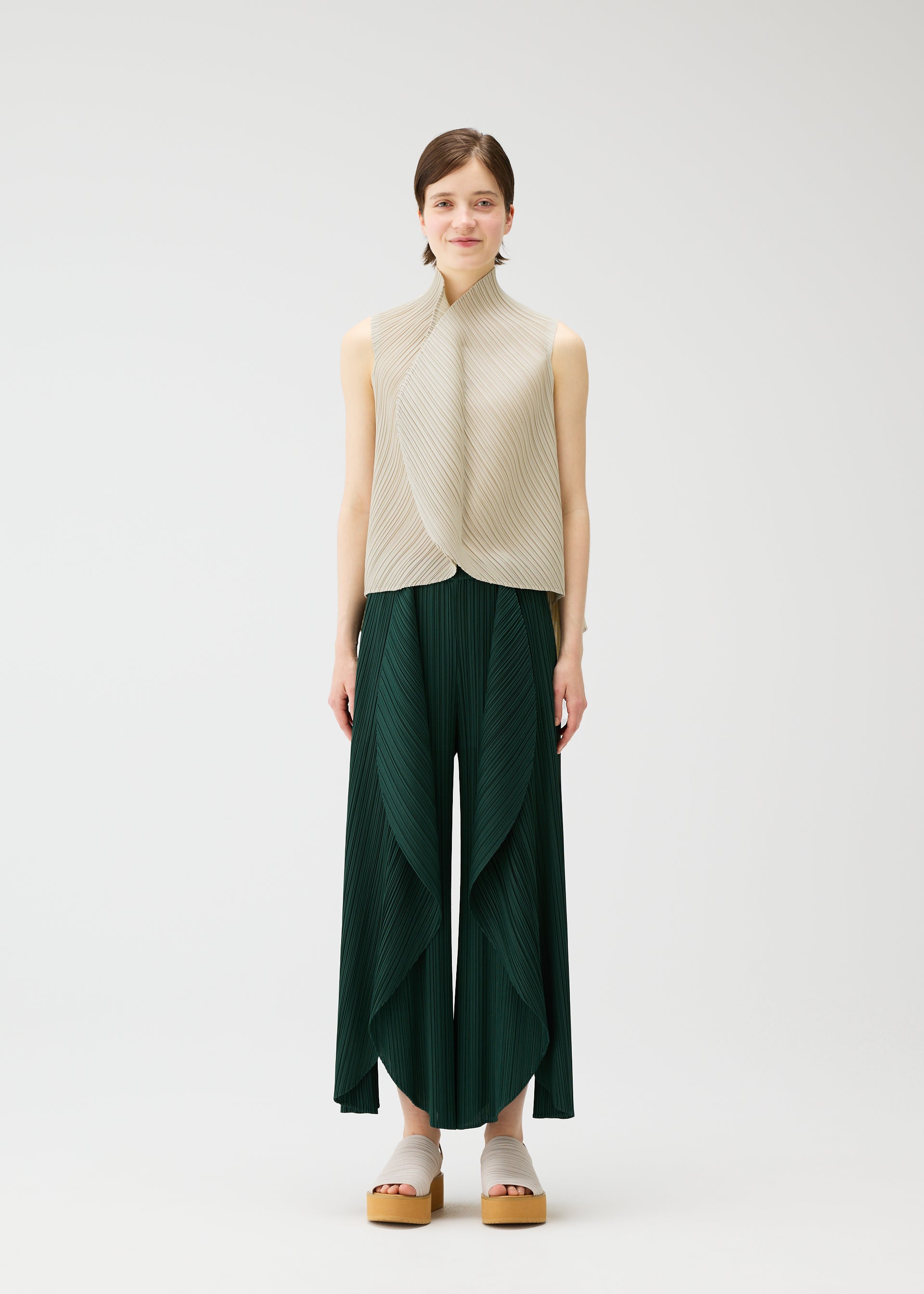 A model wears the PLEATS PLEASE ISSEY MIYAKE LEAF shirt.