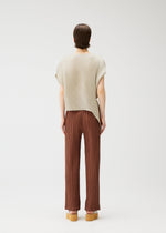 A model wears the PLEATS PLEASE ISSEY MIYAKE LEAF shirt.