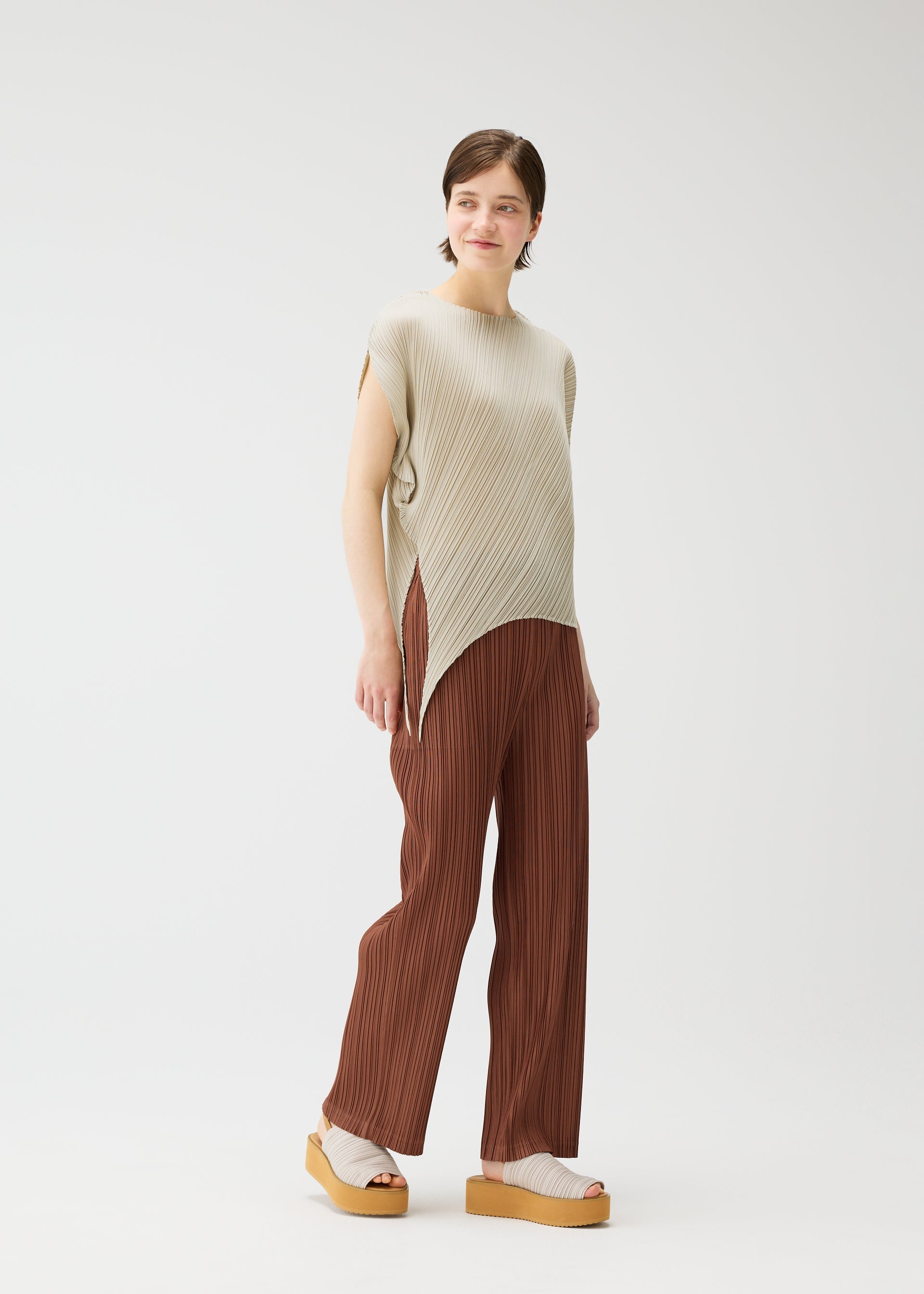 A model wears the PLEATS PLEASE ISSEY MIYAKE LEAF shirt.