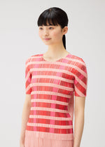 A model wears the PLEATS PLEASE ISSEY MIYAKE BUMPY BASKET bumpy-basket-shirt-green.