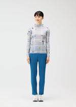 A model wears the PLEATS PLEASE ISSEY MIYAKE CROSSING DOTS shirt.
