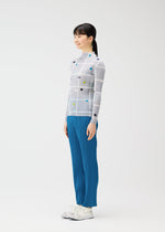 A model wears the PLEATS PLEASE ISSEY MIYAKE CROSSING DOTS shirt.