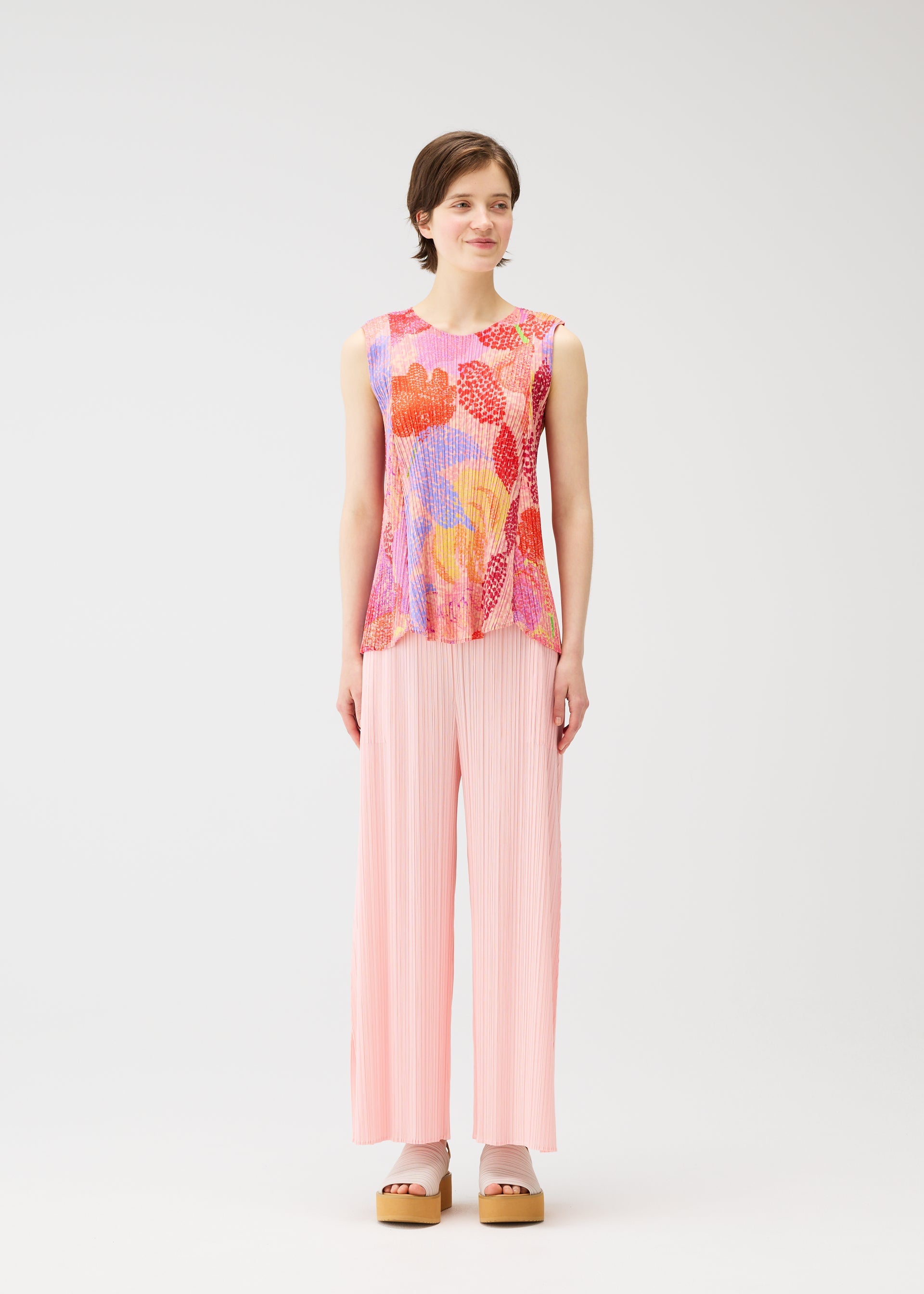 A model wears the PLEATS PLEASE ISSEY MIYAKE FOGGY FOREST shirt.