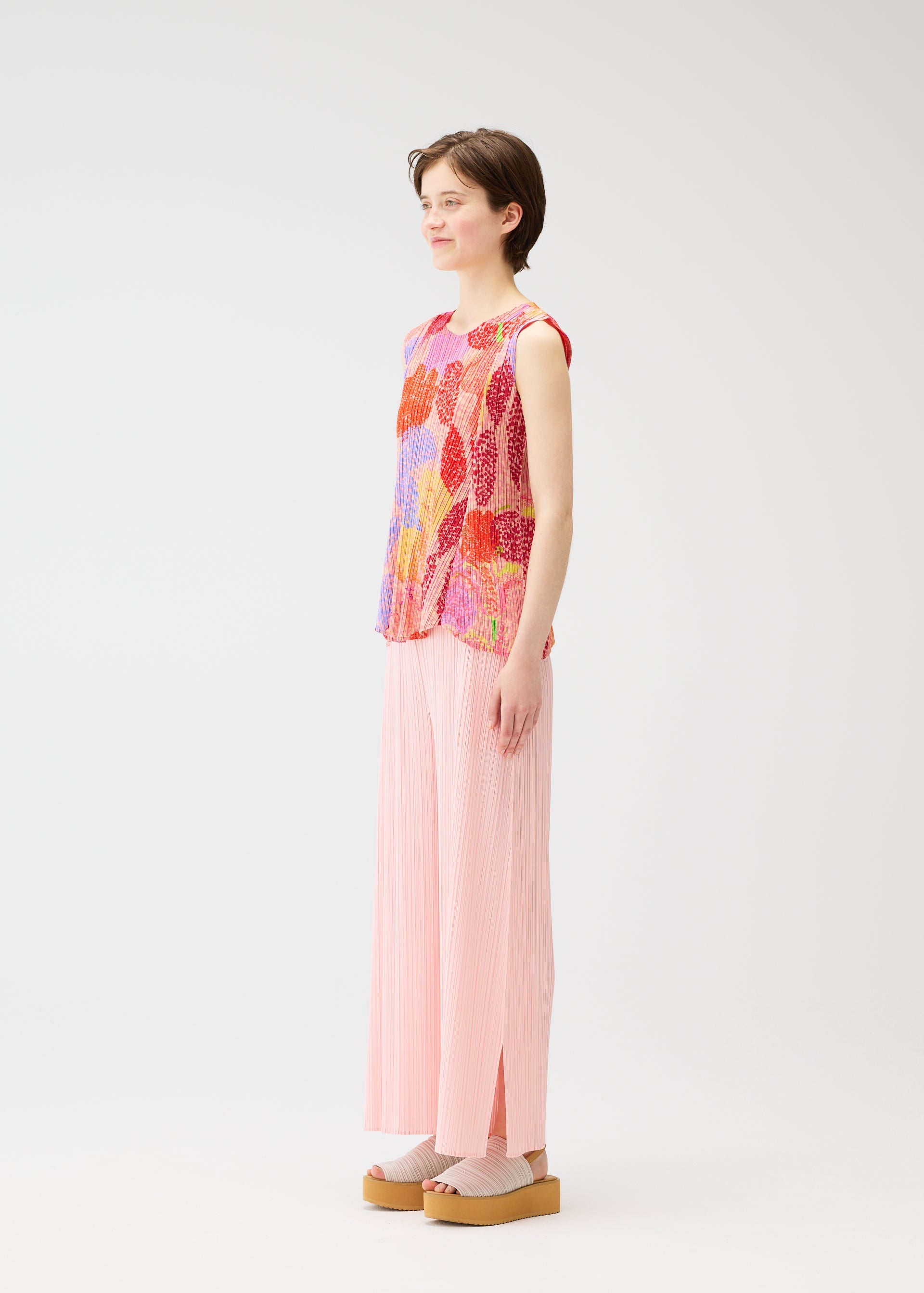 A model wears the PLEATS PLEASE ISSEY MIYAKE FOGGY FOREST shirt.