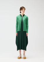 A model wears the PLEATS PLEASE ISSEY MIYAKE MONTHLY COLORS MARCH cardigan.