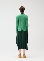 A model wears the PLEATS PLEASE ISSEY MIYAKE MONTHLY COLORS MARCH cardigan.