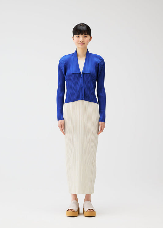 A model wears the PLEATS PLEASE ISSEY MIYAKE MONTHLY COLORS MAY cardigan.