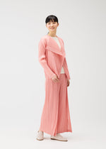 A model wears the PLEATS PLEASE ISSEY MIYAKE RAMIE PLEATS cardigan.