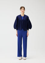 A model wears the PLEATS PLEASE ISSEY MIYAKE COAST cardigan.
