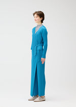 A model wears the PLEATS PLEASE ISSEY MIYAKE FACADE cardigan.