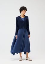 A model wears the PLEATS PLEASE ISSEY MIYAKE CITY FRAME cardigan.