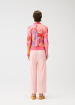 A model wears the PLEATS PLEASE ISSEY MIYAKE FOGGY FOREST cardigan.