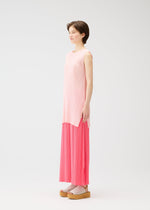 A model wears the PLEATS PLEASE ISSEY MIYAKE MONTHLY COLORS MARCH dress.