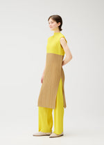 A model wears the PLEATS PLEASE ISSEY MIYAKE SWING dress.