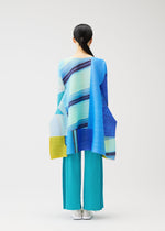 A model wears the PLEATS PLEASE ISSEY MIYAKE CITY COLLAGE clothing.