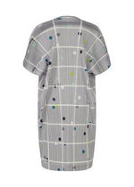 A detail shot of the PLEATS PLEASE ISSEY MIYAKE CROSSING DOTS dress.