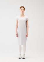 A model wears the PLEATS PLEASE ISSEY MIYAKE A POC SKIN trousers.