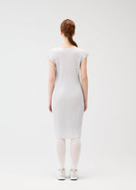 A model wears the PLEATS PLEASE ISSEY MIYAKE A POC SKIN trousers.