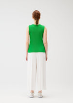 A model wears the PLEATS PLEASE ISSEY MIYAKE A POC BOTTOMS trousers.