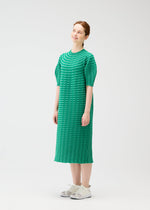 A model wears the PLEATS PLEASE ISSEY MIYAKE COLORFUL MUSHROOM KNIT dress.