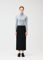 A model wears the PLEATS PLEASE ISSEY MIYAKE A POC SKIN shirt.
