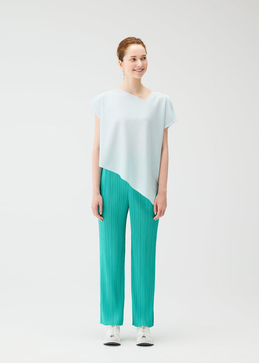 A model wears the PLEATS PLEASE ISSEY MIYAKE A POC SEA GLASS top.