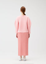 A model wears the PLEATS PLEASE ISSEY MIYAKE COLORFUL MUSHROOM KNIT shirt.