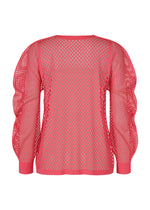 A detail shot of the PLEATS PLEASE ISSEY MIYAKE A-POC BASKET cardigan.