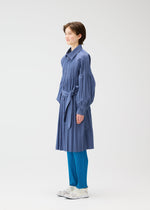 A model wears the PLEATS PLEASE ISSEY MIYAKE SMOOTH COAT coat.