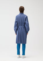 A model wears the PLEATS PLEASE ISSEY MIYAKE SMOOTH COAT coat.