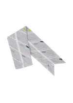 A product shot of the PLEATS PLEASE ISSEY MIYAKE CROSSING DOTS SCARF stole in light grey (10).