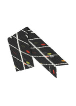 A product shot of the PLEATS PLEASE ISSEY MIYAKE CROSSING DOTS SCARF stole in black (15).