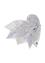 A detail shot of the PLEATS PLEASE ISSEY MIYAKE CROSSING DOTS SCARF stole.