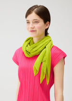 A model wears the PLEATS PLEASE ISSEY MIYAKE MONTHLY SCARF JUNE monthly-scarf-june-stole-yellow-green.