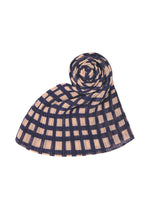A detail shot of the PLEATS PLEASE ISSEY MIYAKE BASKET MADAME-T stole.