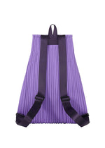 A detail shot of the PLEATS PLEASE ISSEY MIYAKE PLEATS KNAPSACK bag.