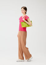 A model wears the PLEATS PLEASE ISSEY MIYAKE PLEATS BOSTON BAG pleats-boston-bag-bag-black-2.