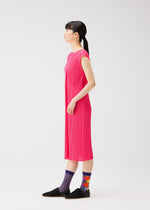 A model wears the PLEATS PLEASE ISSEY MIYAKE MARKET SOCKS market-socks-socks-tomato.