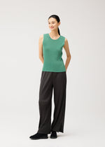 A model wears the PLEATS PLEASE ISSEY MIYAKE MIST AUGUST mist-august-top-greyish-green.