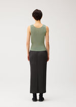 A model wears the PLEATS PLEASE ISSEY MIYAKE MIST SEPTEMBER mist-september-top-navy.